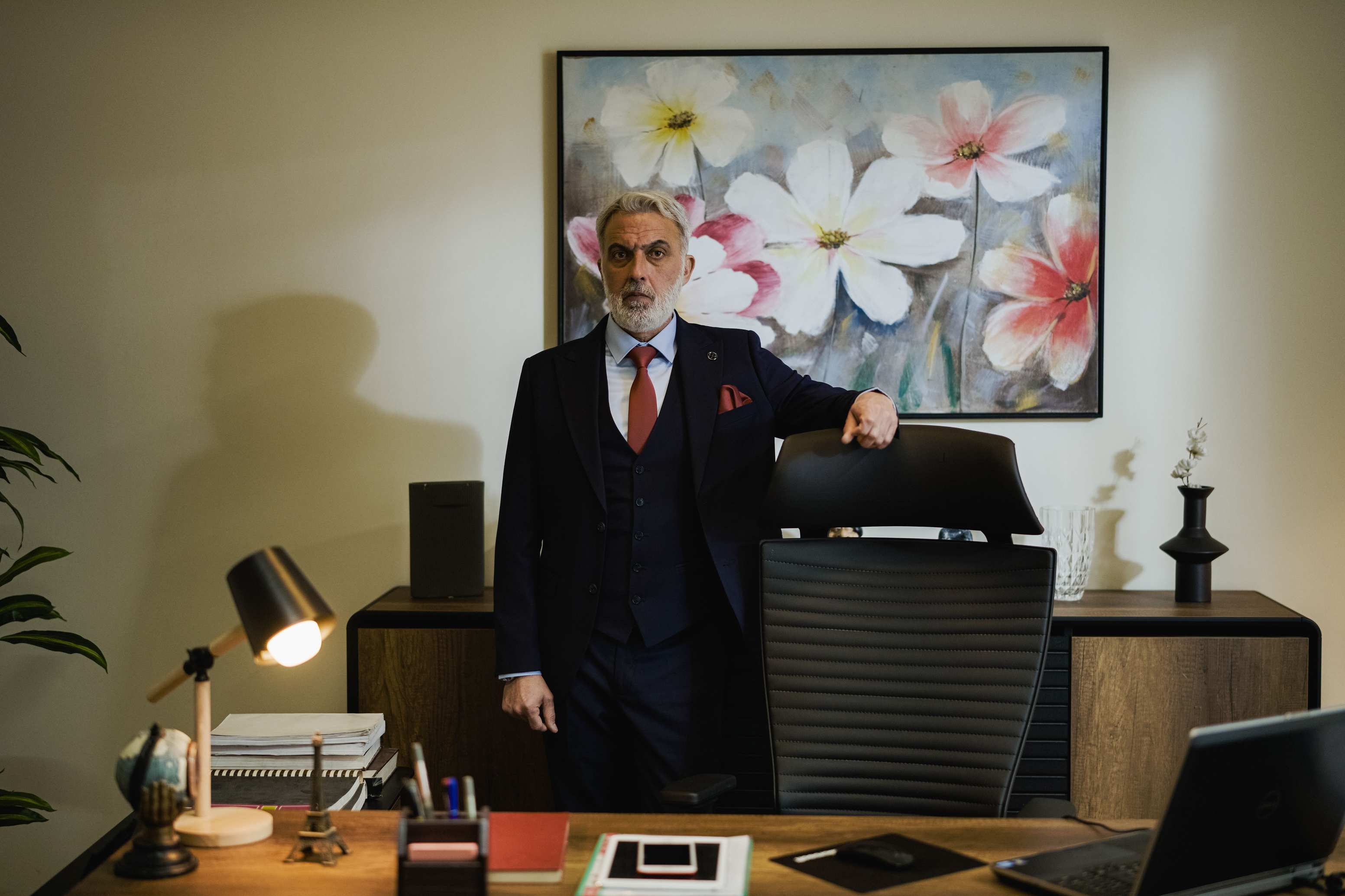 Modern office with a businessman standing confidently
